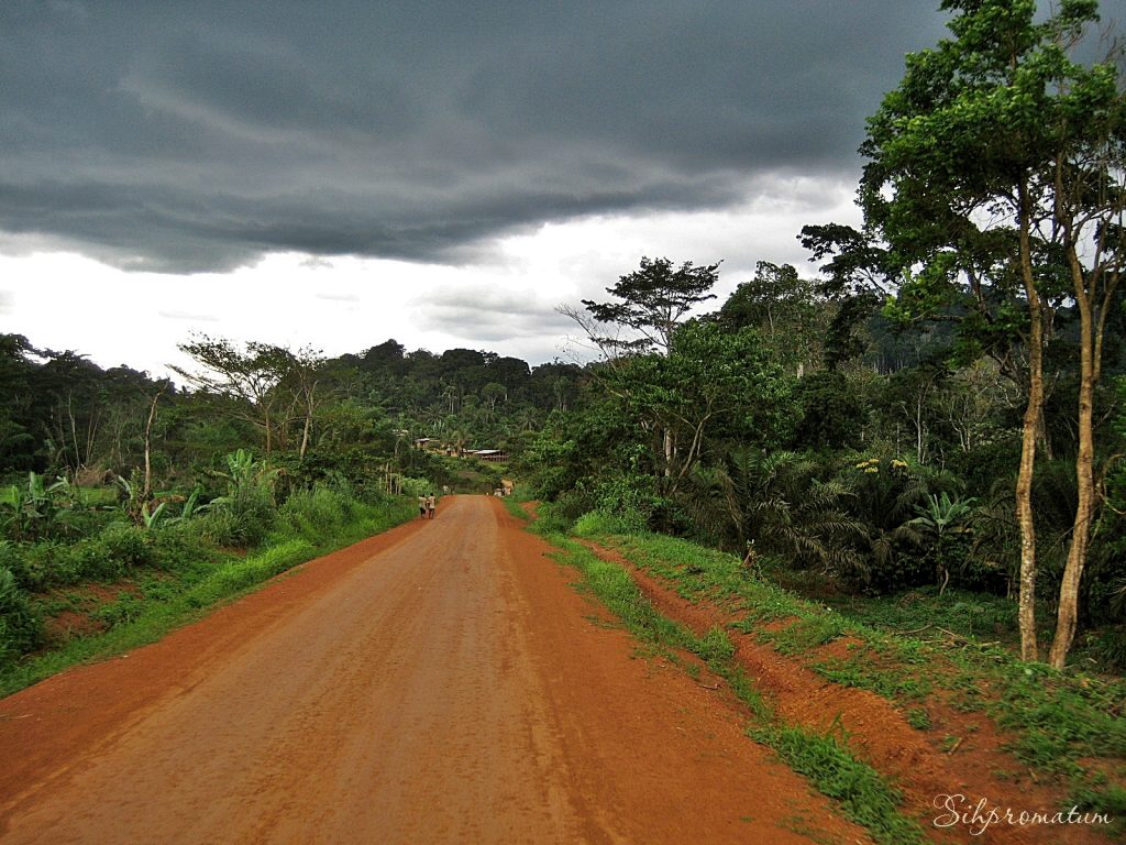 12-Smooth-road-and-looming-storm-sets-us-up-for-a-muddy-mess-in-Benin-West-Africa.-1024x768