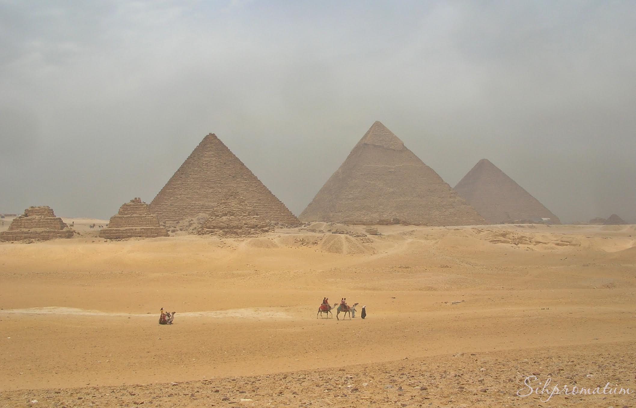 Ancient-Giza-Pyramids-seen-from-camelback-Cairo-Egypt.