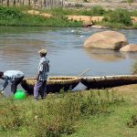 Children-by-the-riverside-in-Hampi-with-their-handmade-boats-150x150